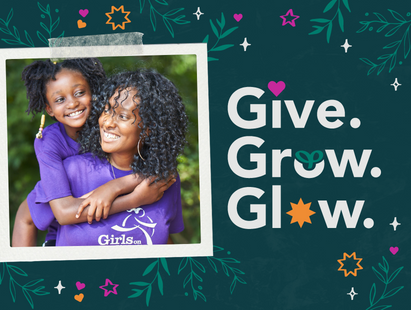 A Girls on the Run participant and a coach are hugging with the words "Give. Grow. Glow"